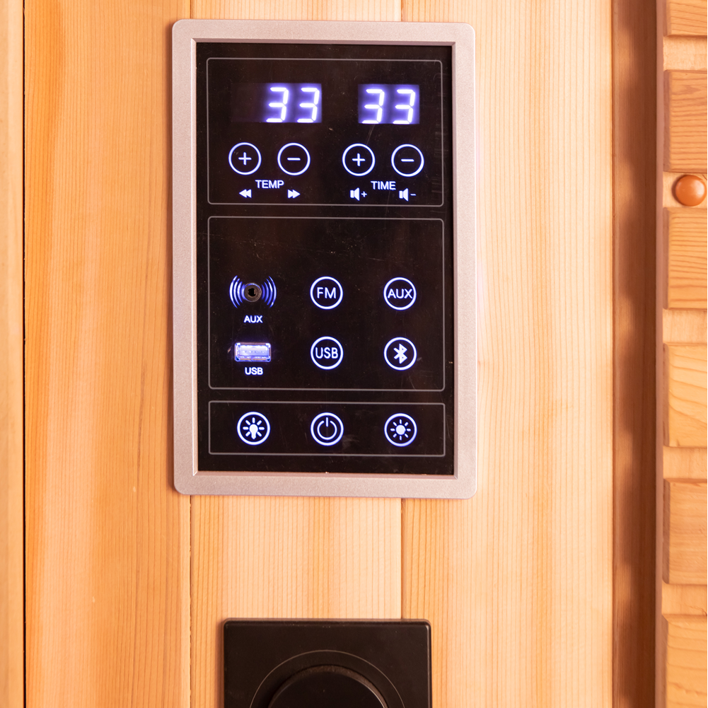 Chill Bunny Indoor Infrared Sauna digital control panel with temperature and time settings on wooden wall