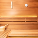 Chill Bunny wooden sauna interior with bench, bucket, ladle, thermometer, and timer on wall
