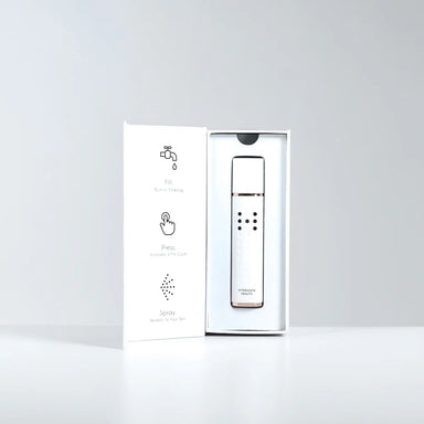 Hydrogen Health hydrogen skin mister in white with rose gold accents displayed in an open box