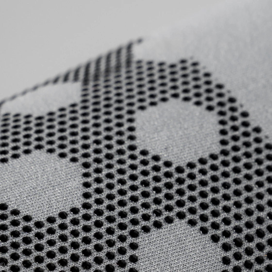 Close-up of textured black and gray hydrogen water bottle cover with dotted pattern by HYDROGEN HEALTH