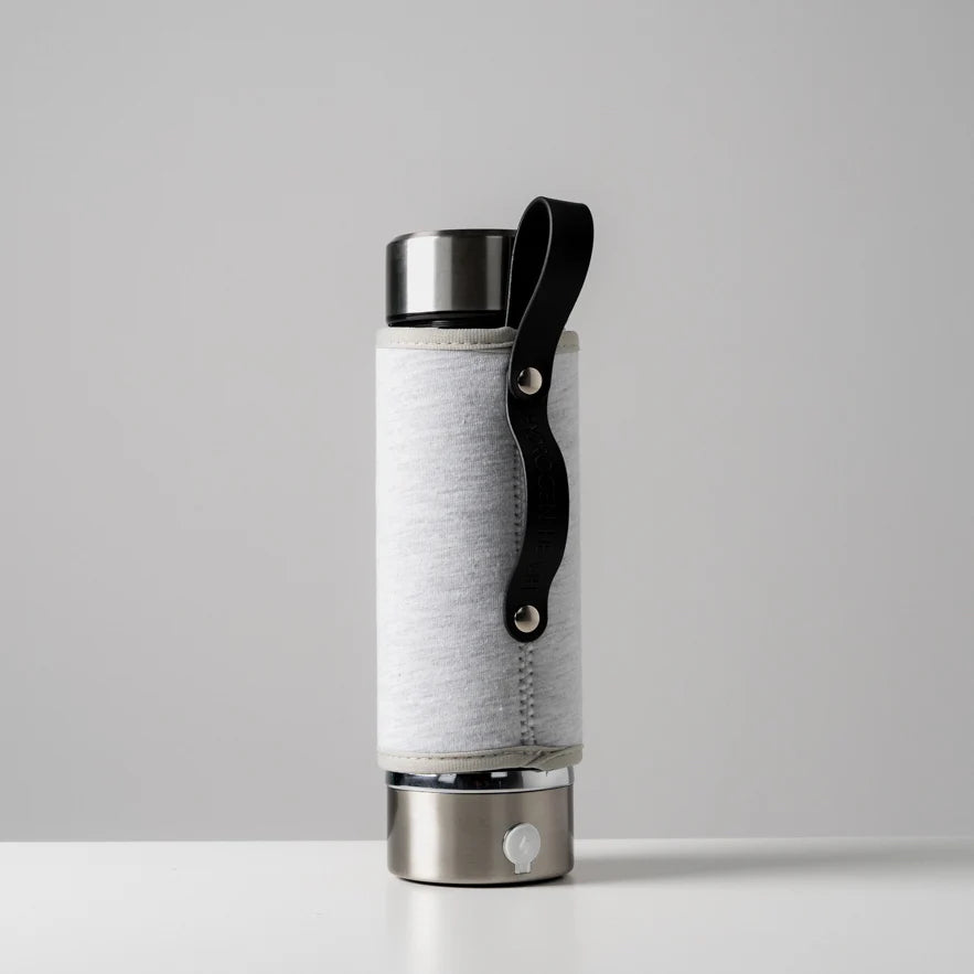 Hydrogen Health hydrogen water bottle cover in white with black handle for hydrogen water devices