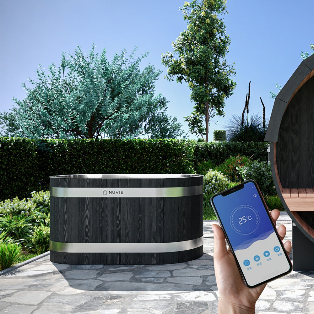 Nuvie ice bath outdoors with dark wood finish controlled by smartphone app showing 25 degrees Celsius