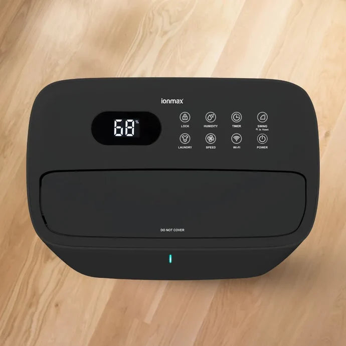 Ionmax black dehumidifier with digital display and multiple control buttons on top
