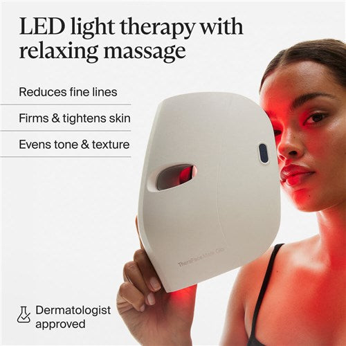 Therabody LED mask held by woman showing red light therapy for fine lines and skin firming