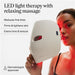 Therabody LED mask held by woman showing red light therapy for fine lines and skin firming