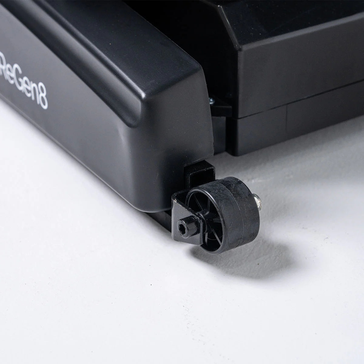 Close-up of a black caster wheel on a Lifespan Fitness massage chair base