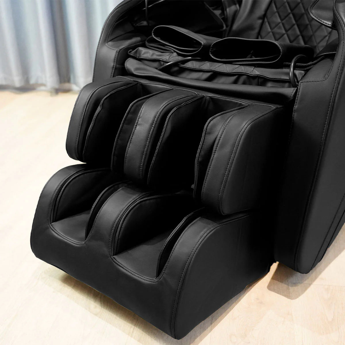 Lifespan Fitness black leather massage chair with padded leg and foot massager sections