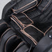 Lifespan Fitness black massage chair with padded cushions and gold trim detailing