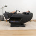 Lifespan Fitness LuxCloud Glide massage chair in black with reclined person using it in modern living room