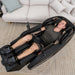 Lifespan Fitness massage chair in black with a man relaxing with full-body leg and neck massage features