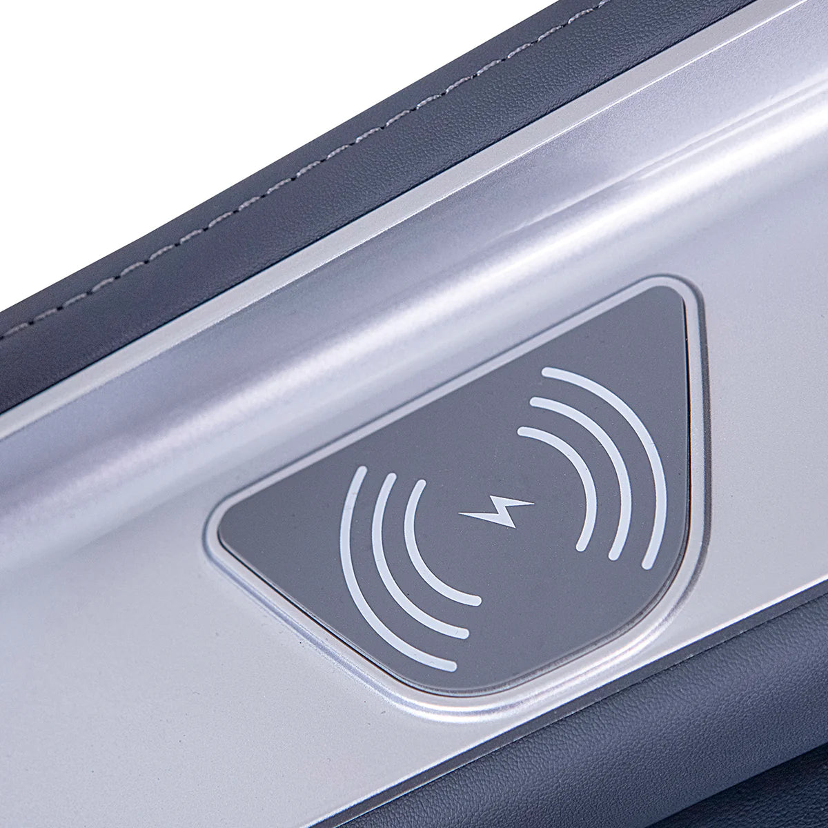 Close-up of wireless charging symbol on Lifespan Fitness massage chair armrest