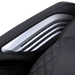 Close-up of black Masseuse massage chair armrest with silver accents and quilted leather upholstery