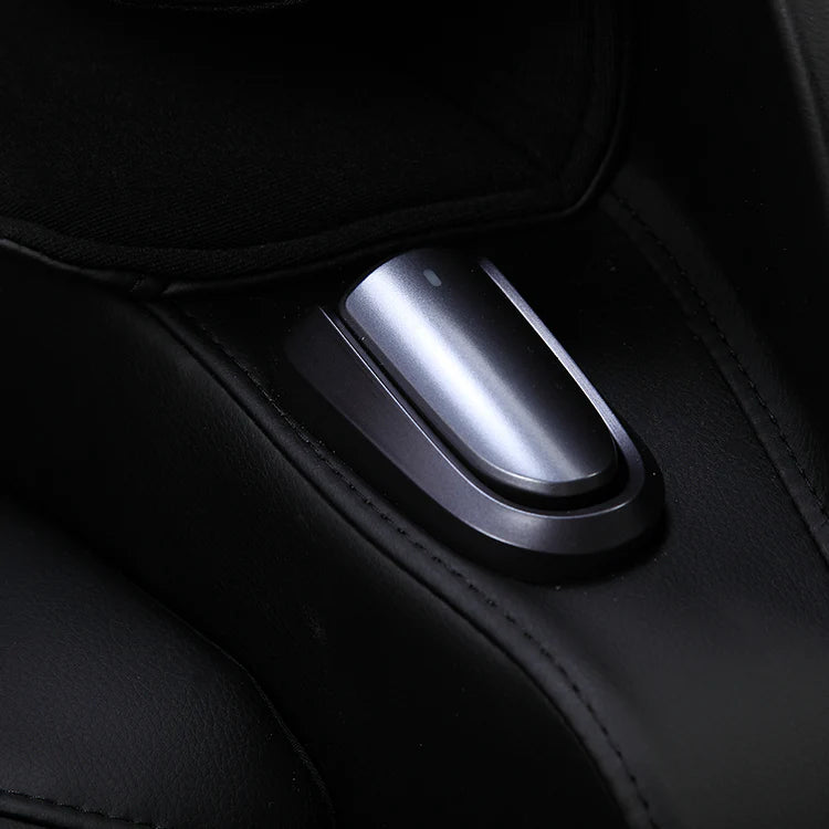 Close-up of sleek black leather massage chair control button for easy adjustment