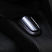 Close-up of sleek black leather massage chair control button for easy adjustment