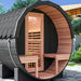 Nuvie outdoor barrel sauna with wooden interior benches and black exterior in backyard setting