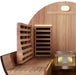 Interior view of Nuvie outdoor barrel sauna with wooden benches and heater for relaxing heat therapy
