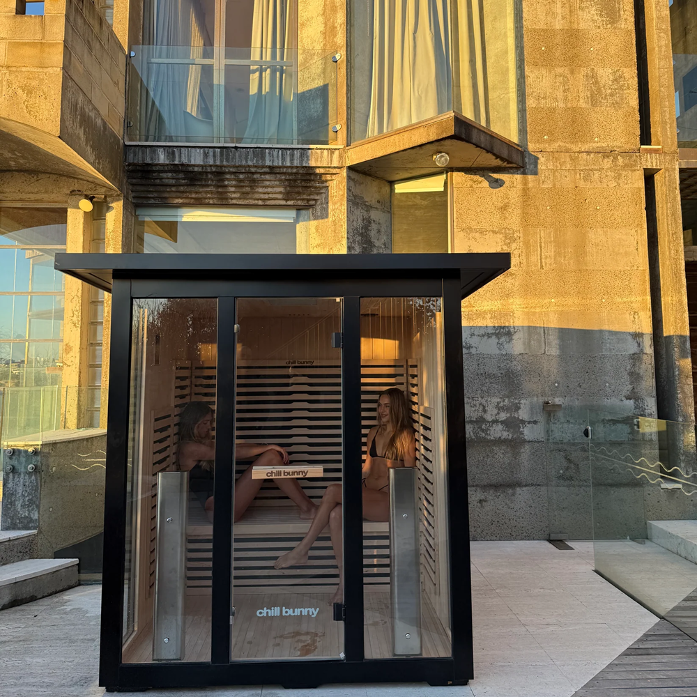 Chill Bunny outdoor infrared sauna with glass panels and wooden interior seating two people