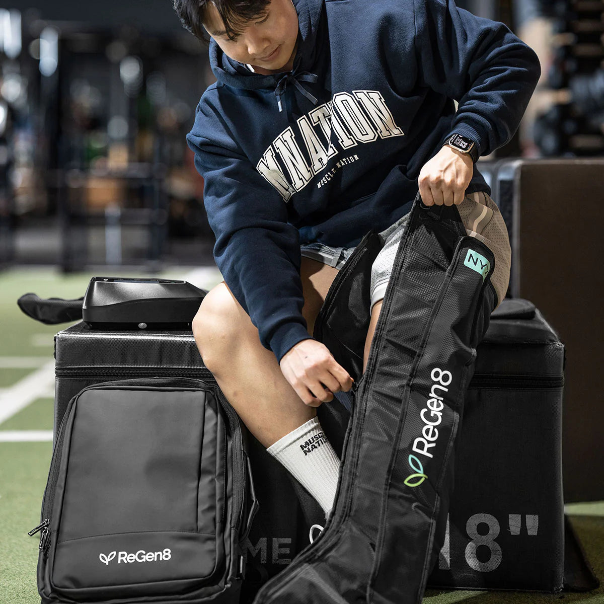 Lifespan Fitness ReGen8 compression boots being worn by a person for recovery and muscle therapy