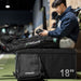 Lifespan Fitness ReGen8 compression boots on man sitting on workout box using control device