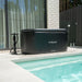 Lifespan Fitness black ReGen8 Polartub ice bath positioned next to a swimming pool outdoors