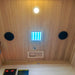 Interior ceiling of Lifespan Fitness sauna with wood paneling, LED light, speakers, and temperature control
