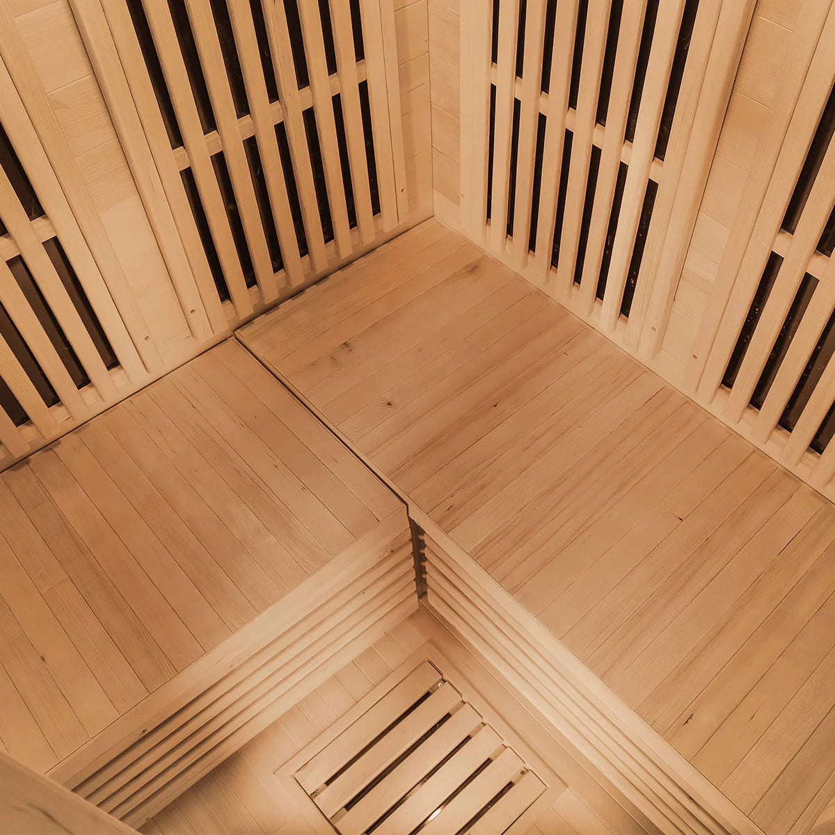Interior corner view of Lifespan Fitness wooden sauna with bench seating and slatted walls