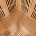 Interior corner view of Lifespan Fitness wooden sauna with bench seating and slatted walls