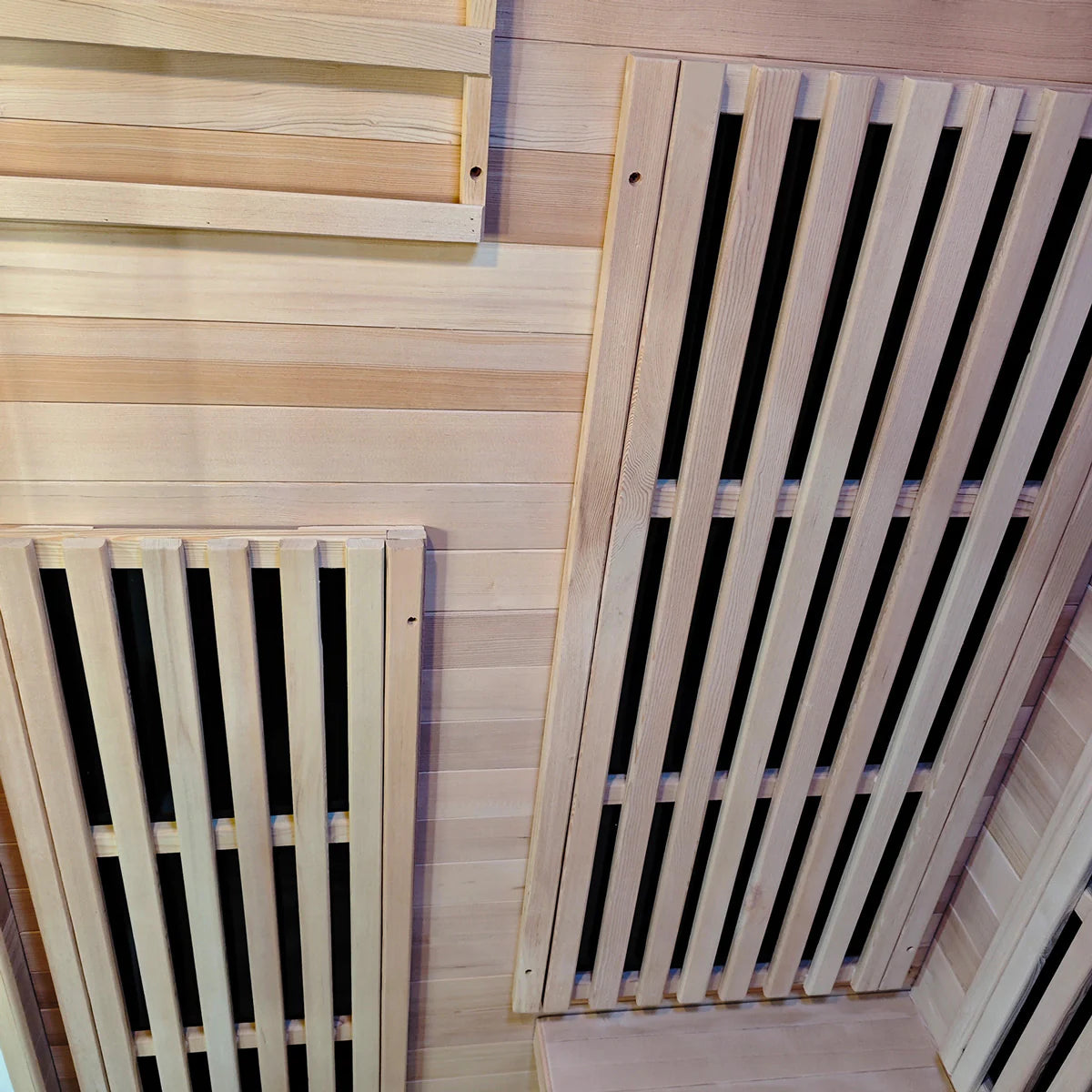 Interior ceiling view of Lifespan Fitness wooden sauna with slatted vents for heat circulation