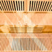 Lifespan Fitness wooden sauna interior with slatted benches and warm lighting