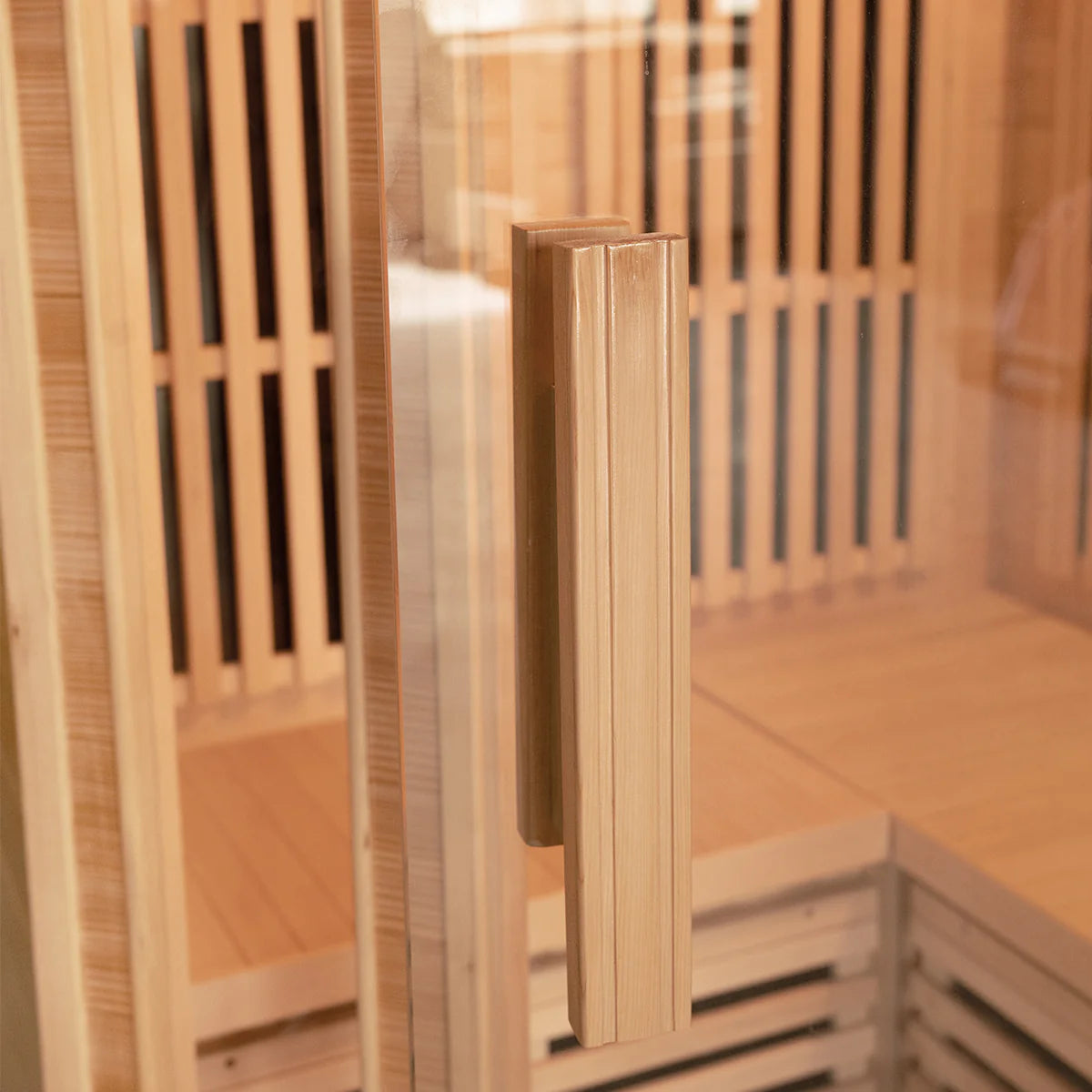 Close-up of wooden handle on Lifespan Fitness sauna door showcasing natural wood design