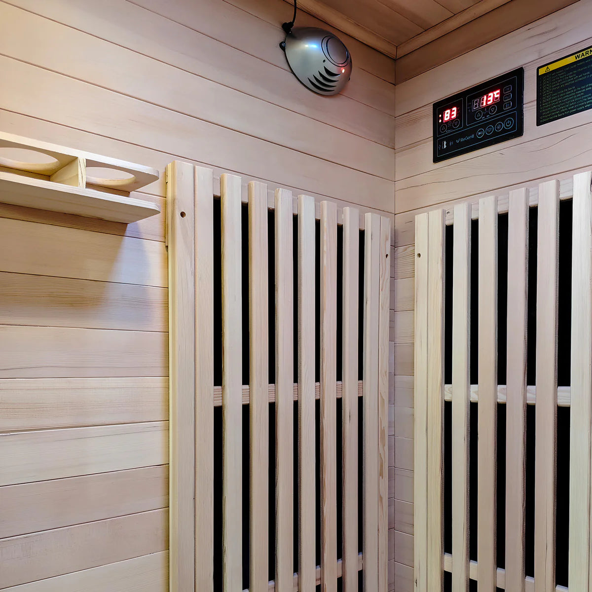 Lifespan Fitness wooden sauna interior with temperature control panel and heated panels