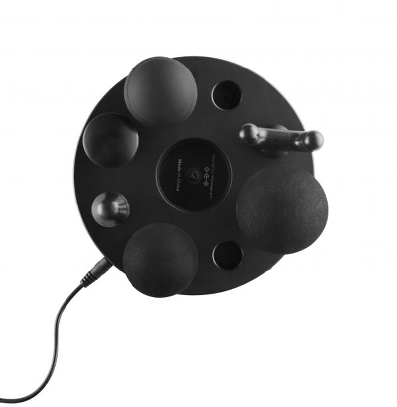 Stryke Recovery massage gun with multiple interchangeable black massage heads on round holder