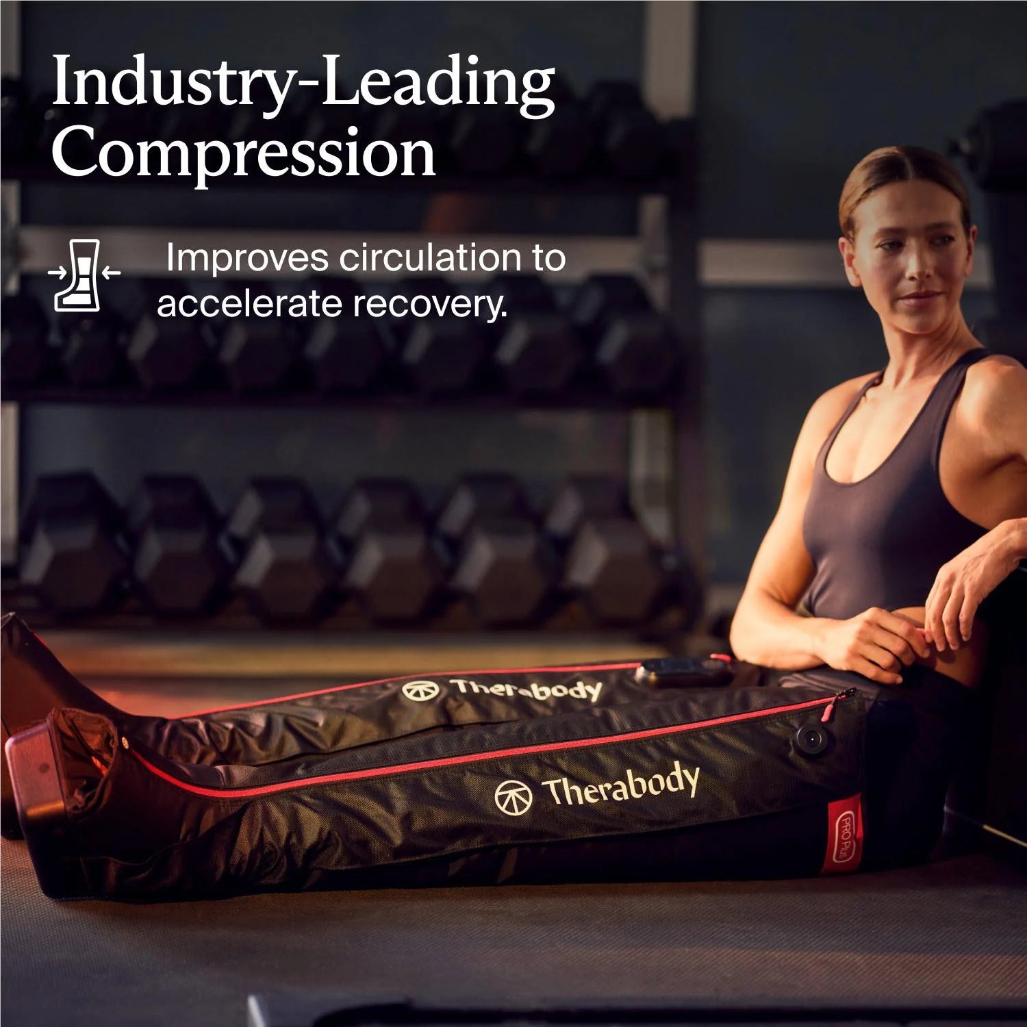 Therabody compression boots displayed on legs of woman sitting in gym for improved circulation and recovery