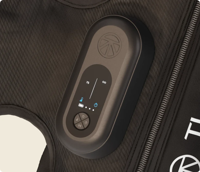 Therabody compression boots control panel showing temperature and pressure settings on black fabric