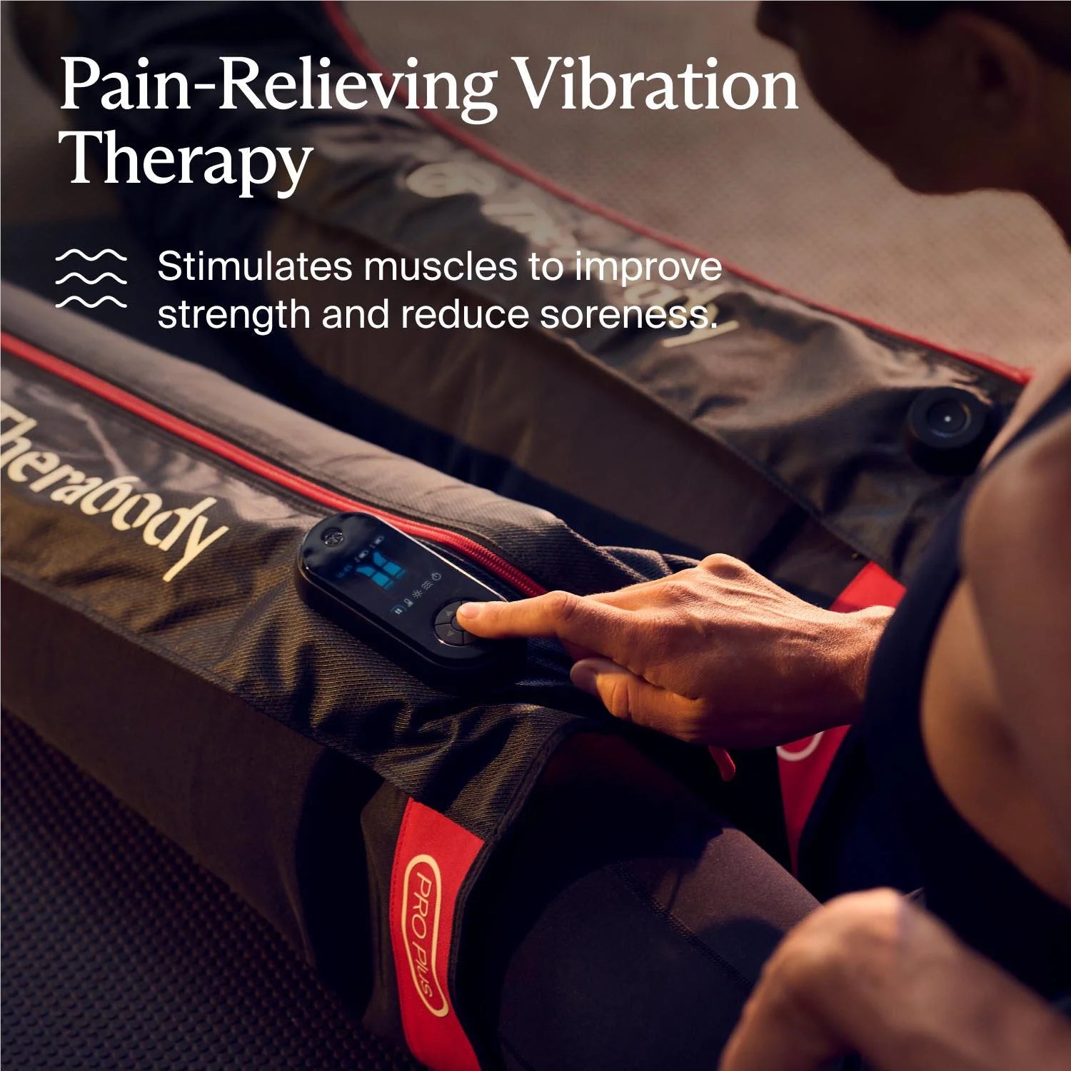 Therabody compression boots with pain-relieving vibration therapy and remote control on a person's legs