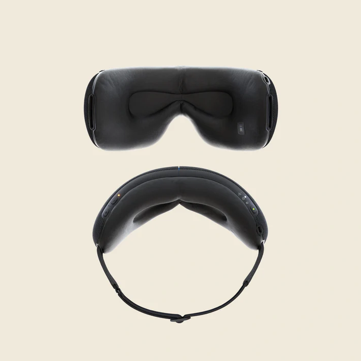 Therabody black eye and temple massager shown from front and top view with adjustable strap