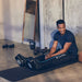 man using therabody recoveryair jetboots compression boots
