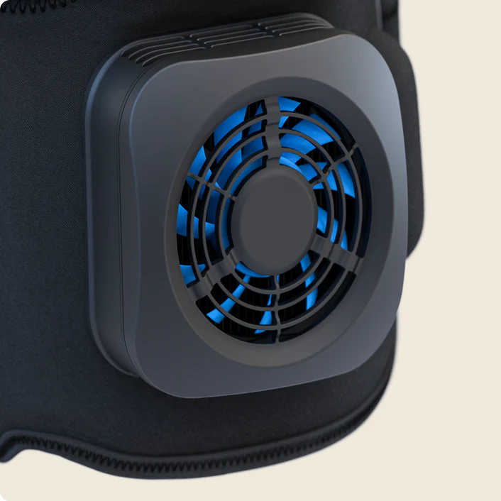 Therabody recoverytherm knee hot and cold therapy device with cooling fan on knee wrap
