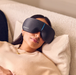 Woman laying down wearing therabody smartgoggles eye massager