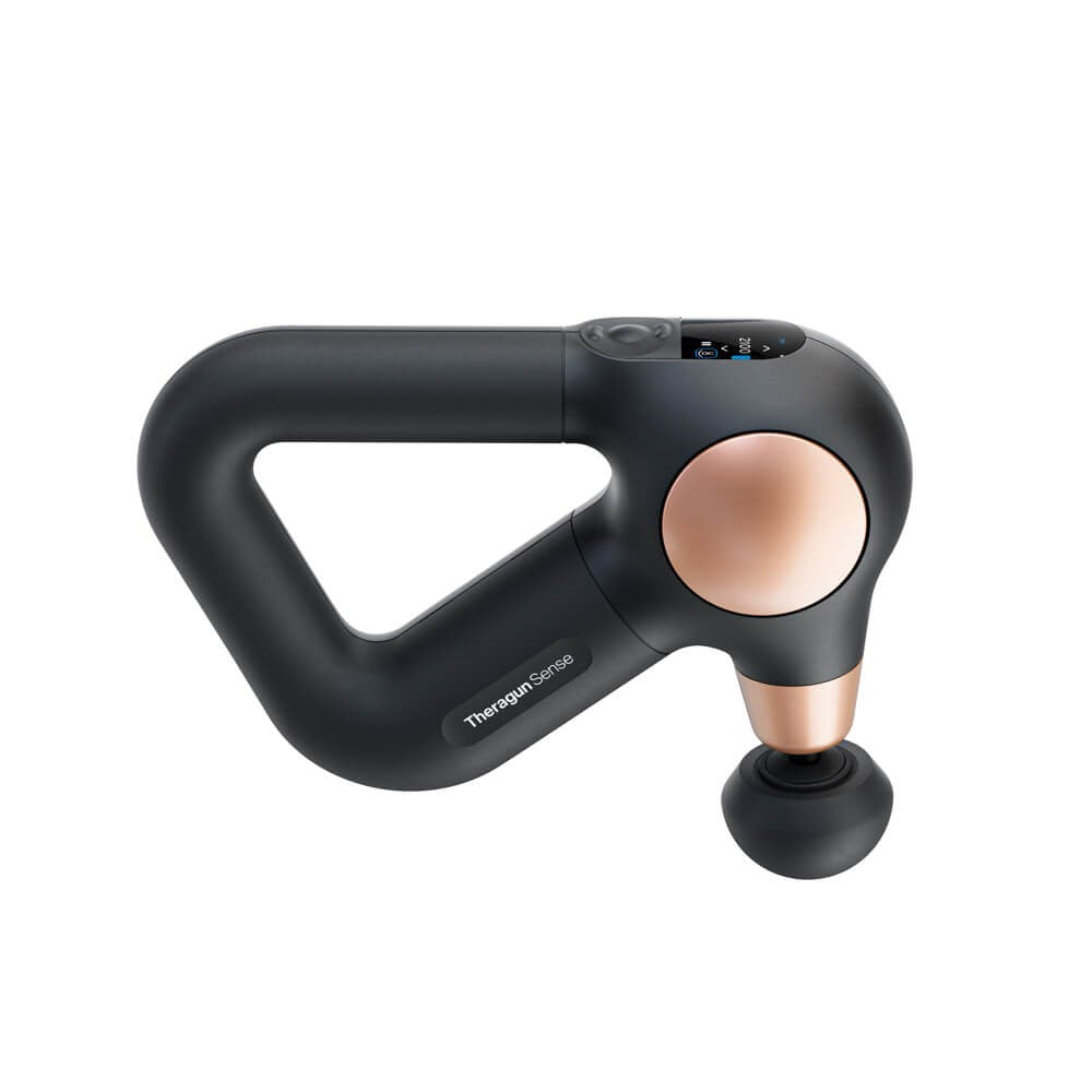 Therabody Theragun massage gun in black with copper accents and digital display for muscle therapy