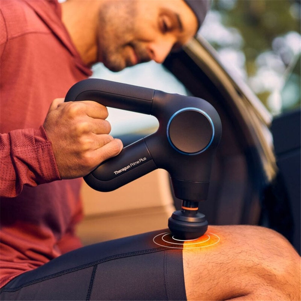 Therabody massage gun in black used on a man's thigh for muscle recovery and pain relief