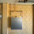 Premium whole house three stage water filtration system mounted to wall